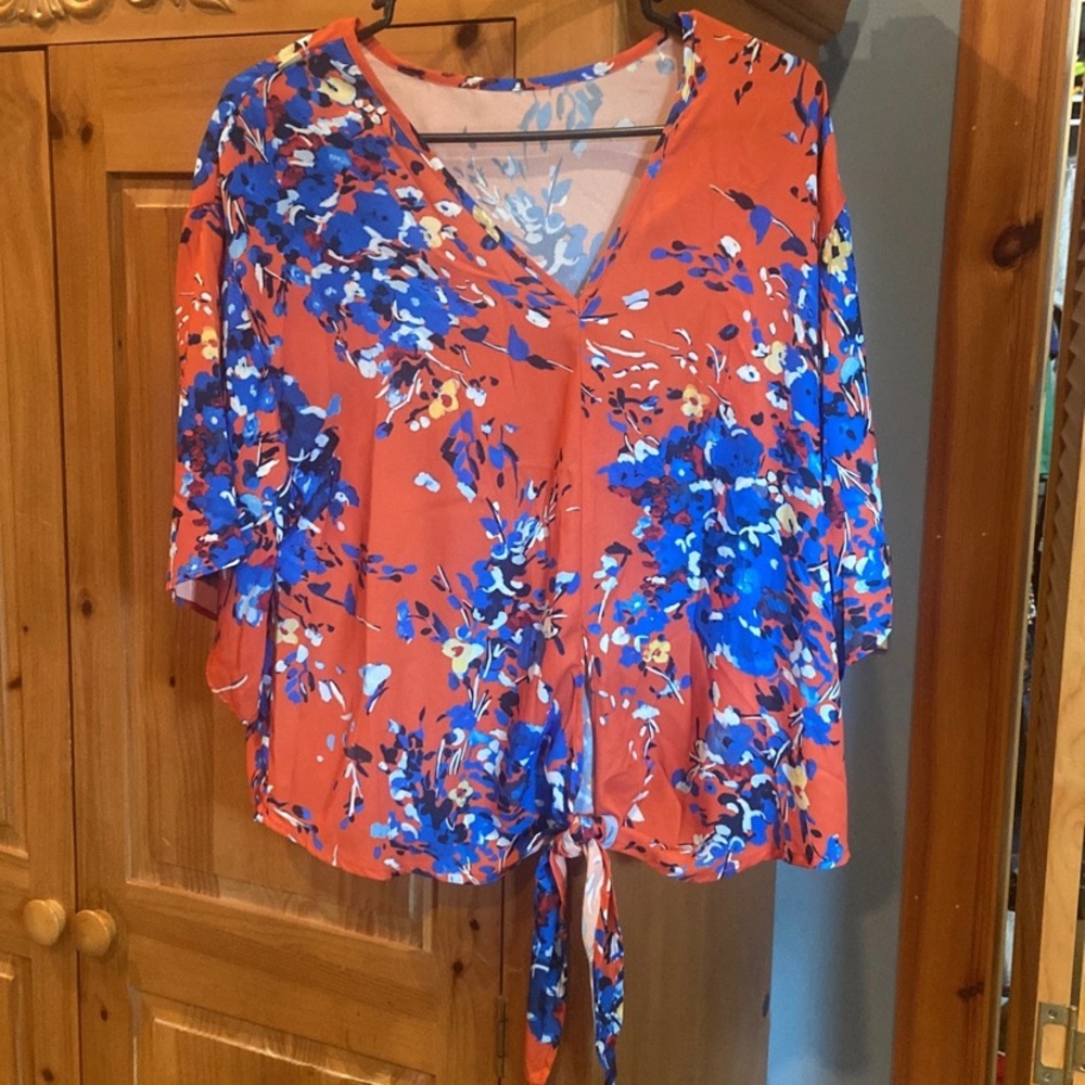 Orange with blue flowers. Knotted bottom.